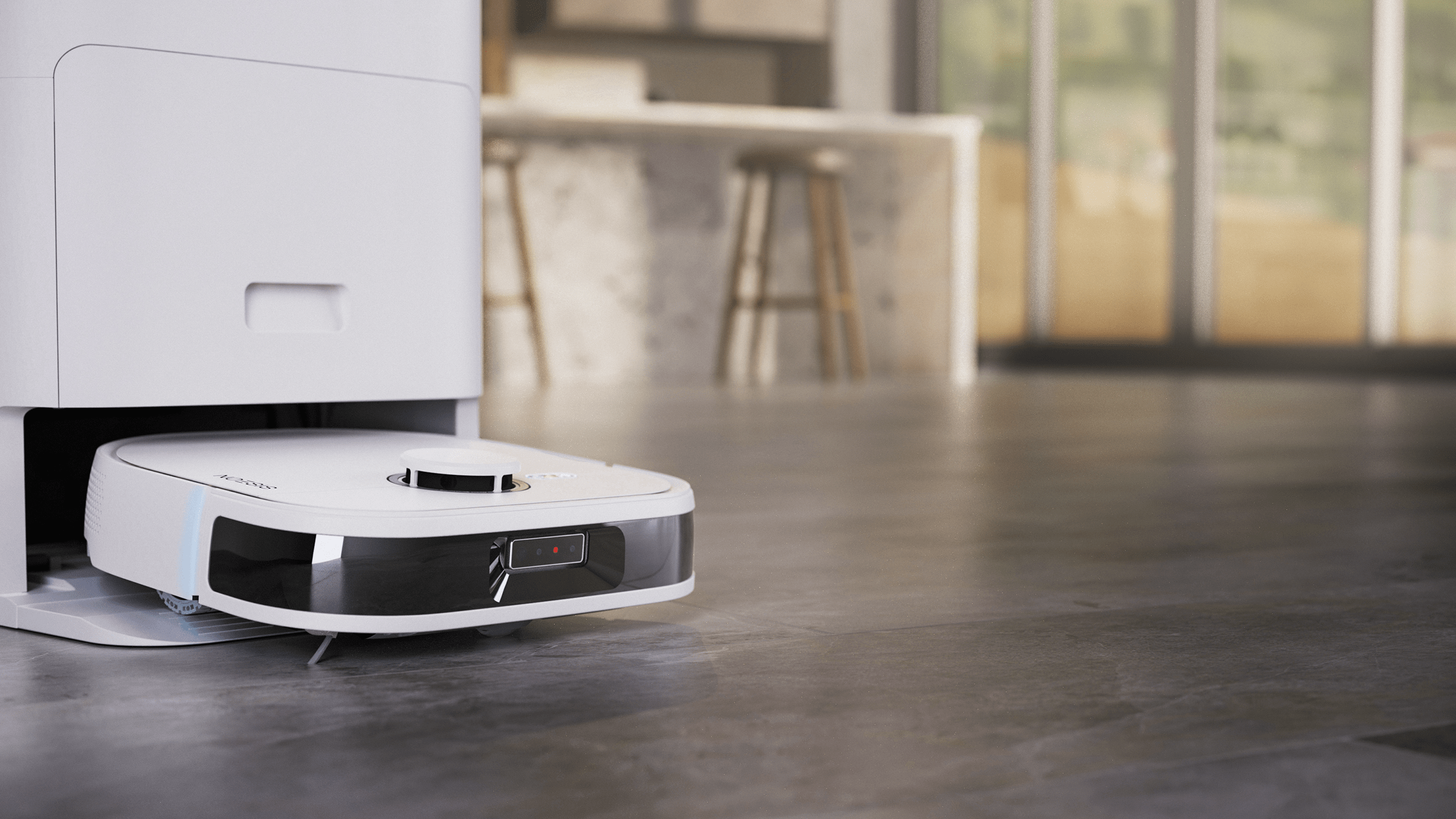 Robot Noesis y estación base en el suelo de una casa